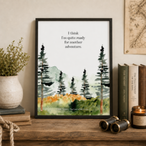 Adventure quote printable in a black frame, centered on a rustic tabletop with Tolkien books, a plant, candle, binoculars, and a vintage map.